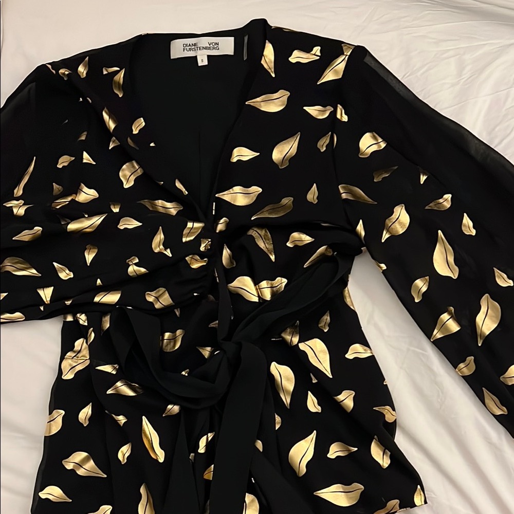 Diane Von Furstenberg Black wrap top with gold lips